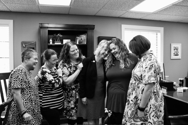 Ann Schneider-Williams with some of the Springfield Memorial branch employees.