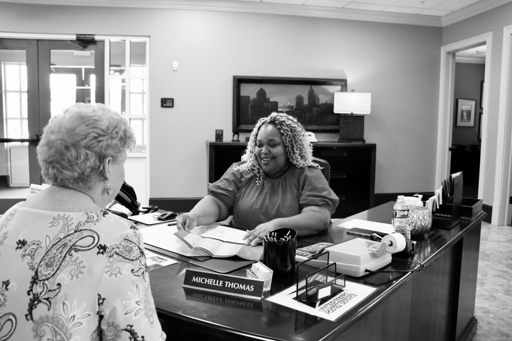 Michelle Thomas with a customer.