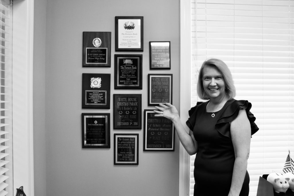 Stanley showing the multiple awards that White House 76 won over the years.